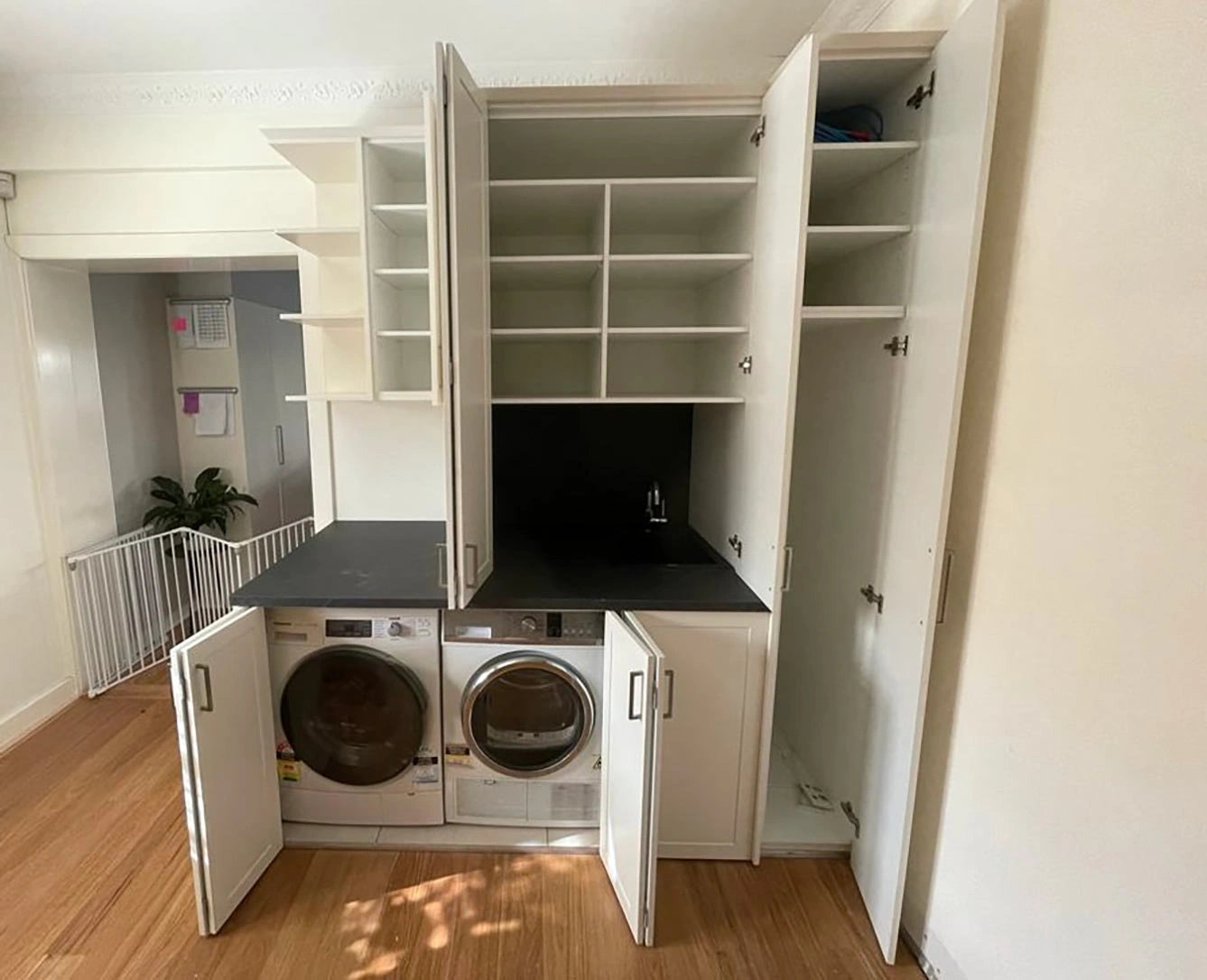 A clean laundry room with a washer and dryer, providing a practical space for washing clothes