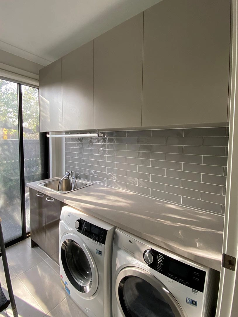 Stylish laundry room equipped with a washer and dryer