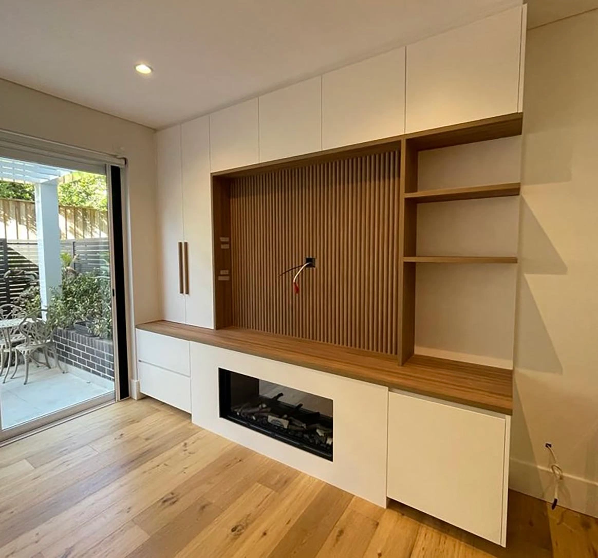 Warm and welcoming room with a fireplace and a built-in entertainment center