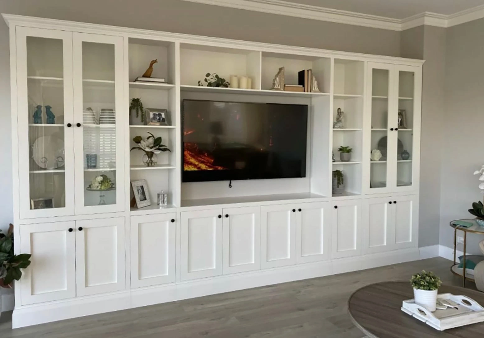 Stylish white entertainment center equipped with a flat screen TV