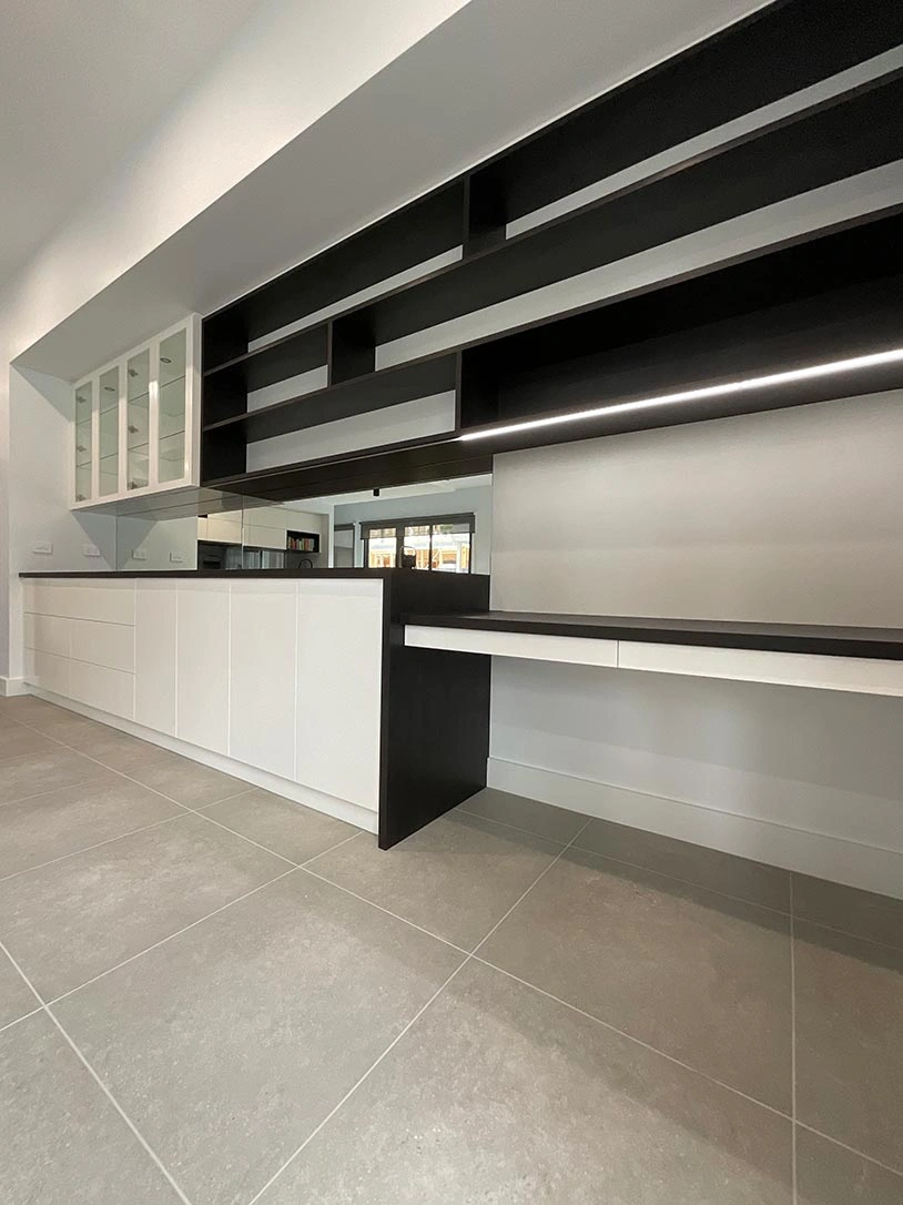 Stylish modern kitchen with a striking contrast of black and white cabinets