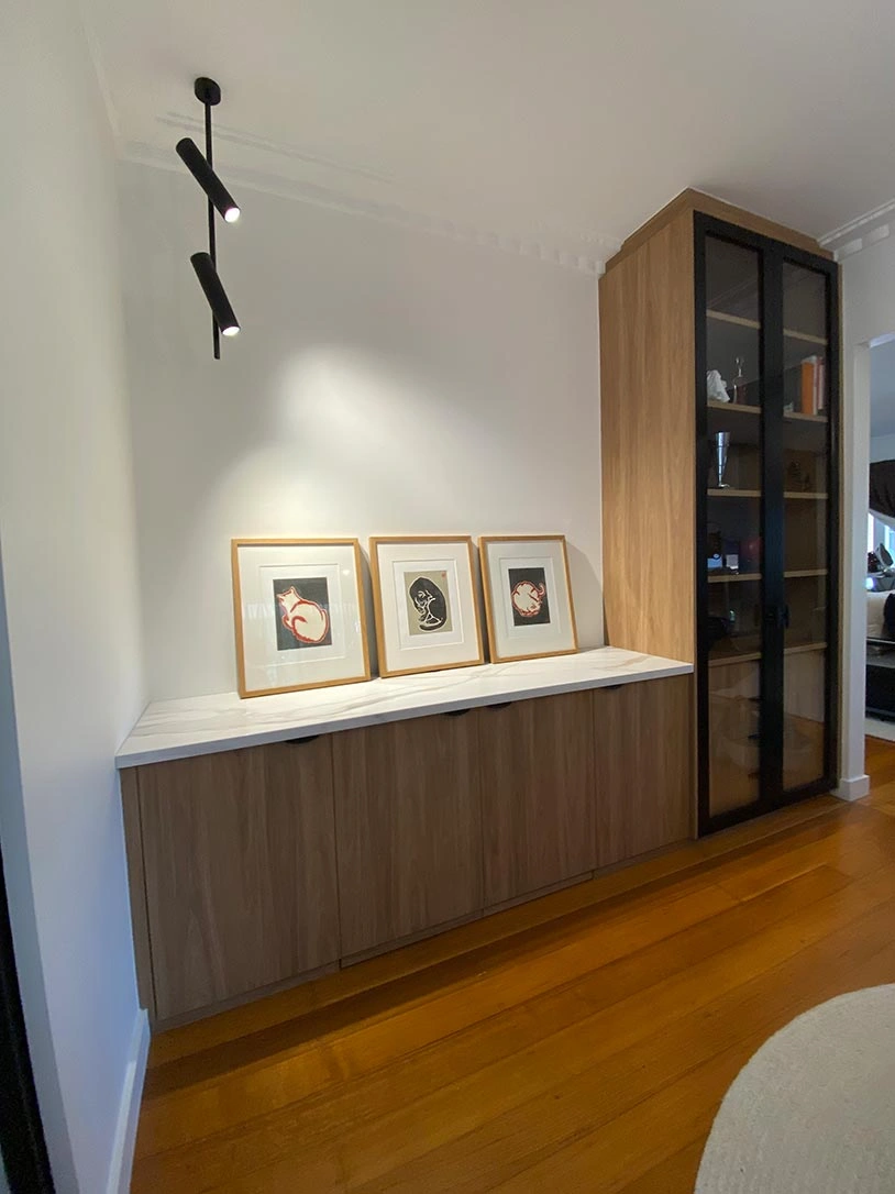 Room with a stylish wooden cabinet and a television