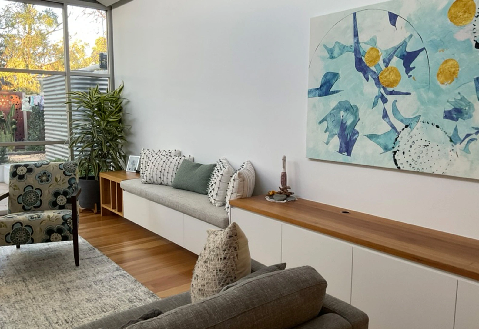 stylish bedroom with a bed complemented by a wall lushly covered in diverse plants