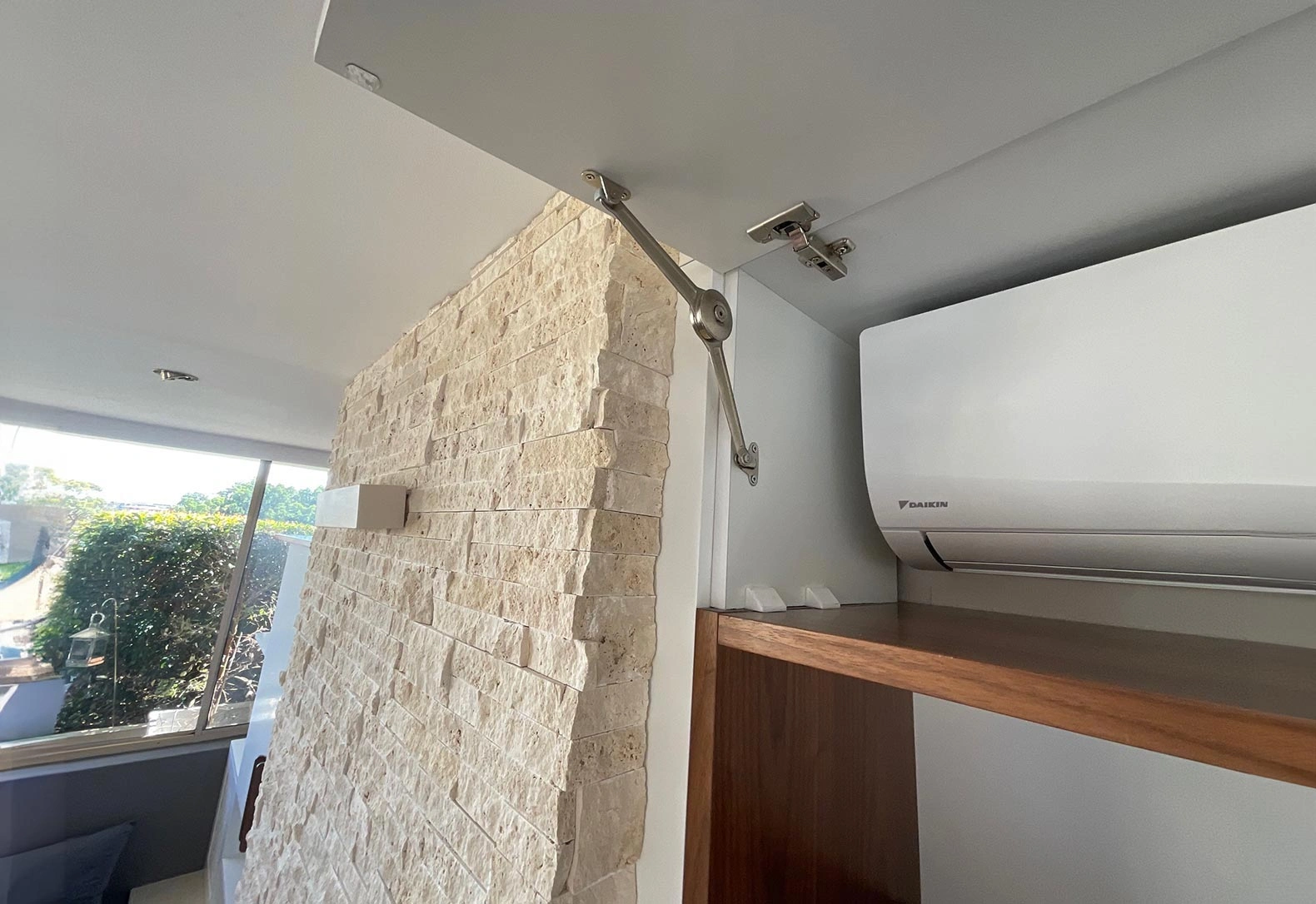 Modern wall-mounted air conditioner in a well-decorated room