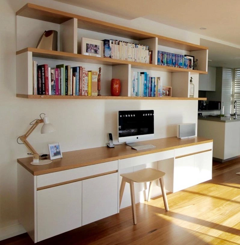 Stylish home office with a desk and bookshelves, providing a functional and inviting environment for productivity