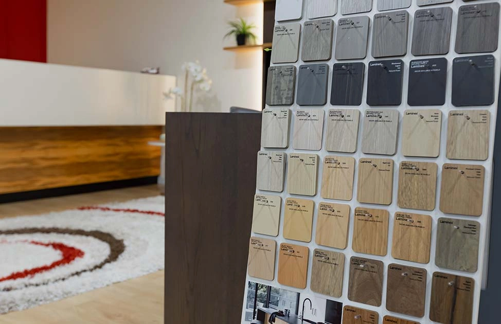 Variety of wood samples showcased in a store, highlighting different textures and colors for customers to explore