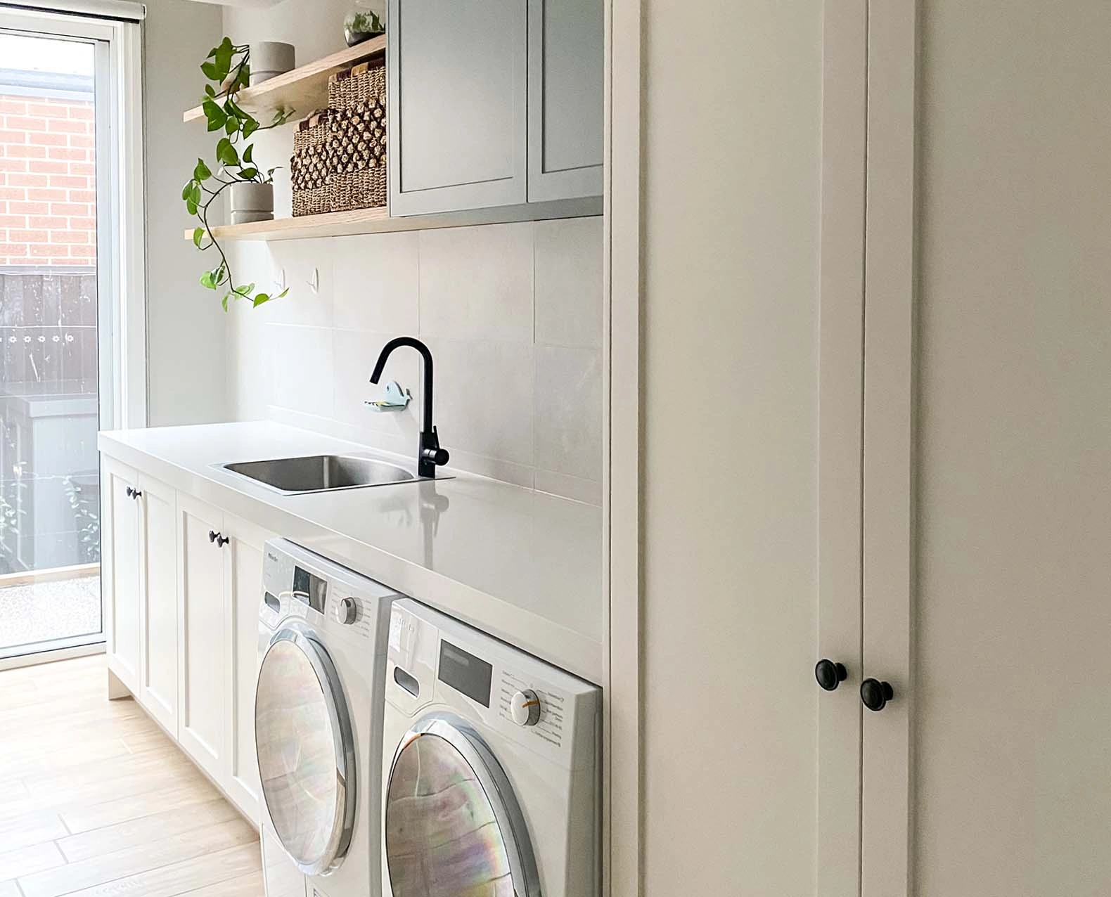 A clean laundry room with a washer and dryer