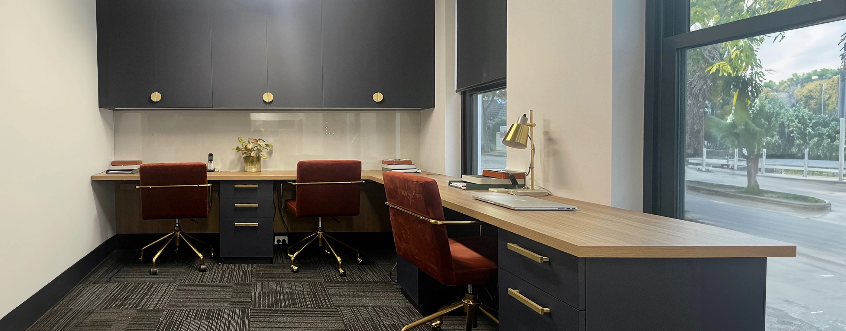 Stylish office setup with a modern desk and comfortable seating, promoting efficiency and a professional ambiance