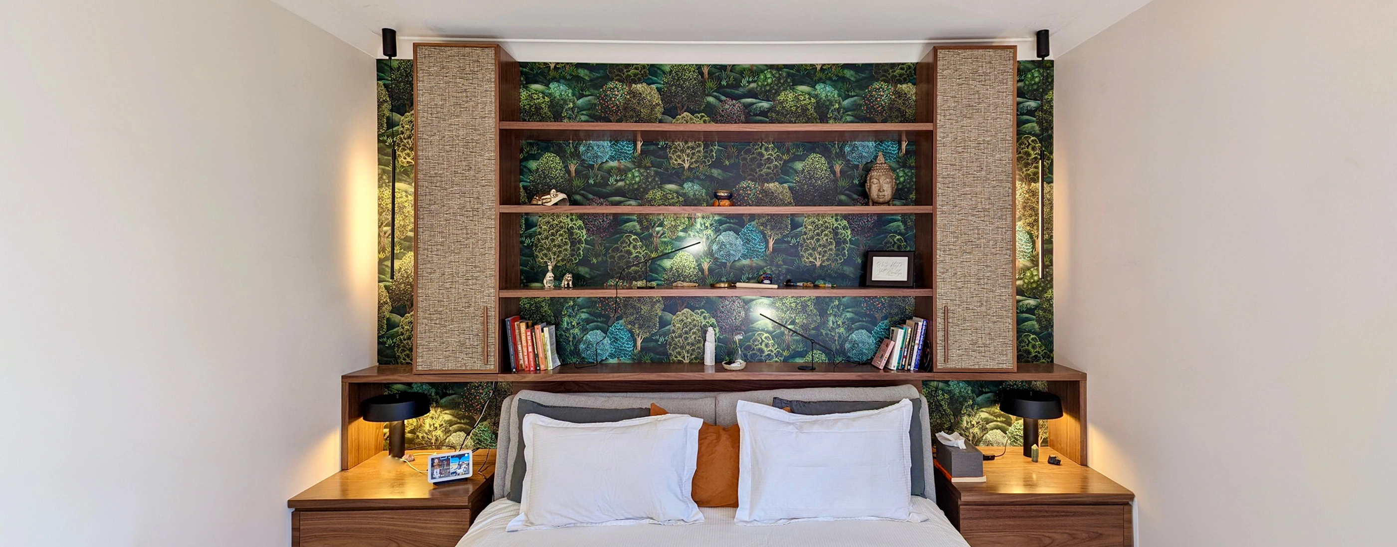 Stylish bedroom with a bed complemented by a wall lushly covered in diverse plants